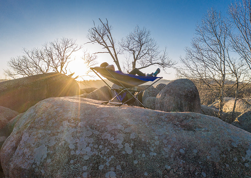 rock camping with portable free standing hammock