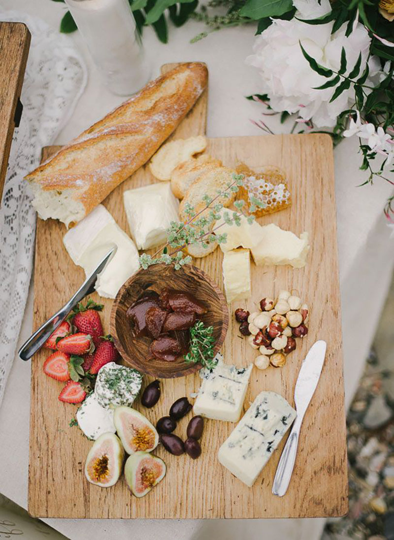 seaside charcuterie board with cheeses, cured meats, and artisanal crackers