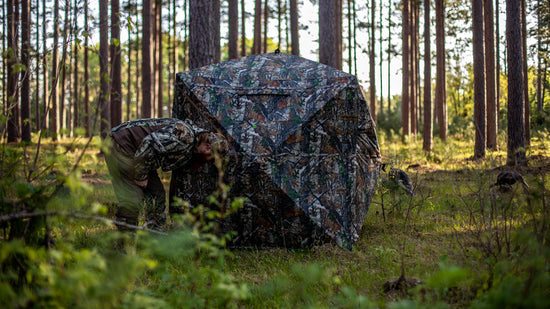 a hunter is preparing his blinds