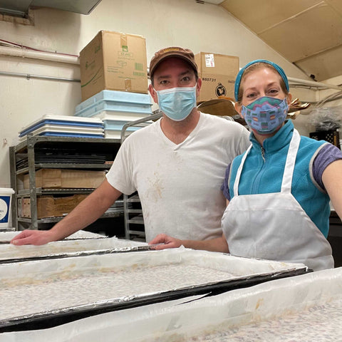 Tracey Muzzolini and Trent Loewen making Christies Bakery'sfruitcake