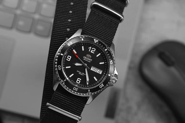 Orient Ray 2 Black Watch over computer parts
