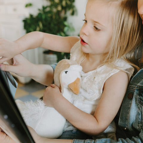 Little Girl Reading Avery the Aviator Storybook from Bunnies By The Bay