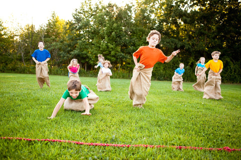 Kids Doing Bunny Hop Sack Race