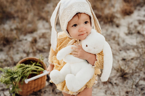 Little Girl Hugging Stuffed Bunny