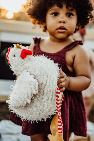 Toddler Girl Holding Stuffed Chicken