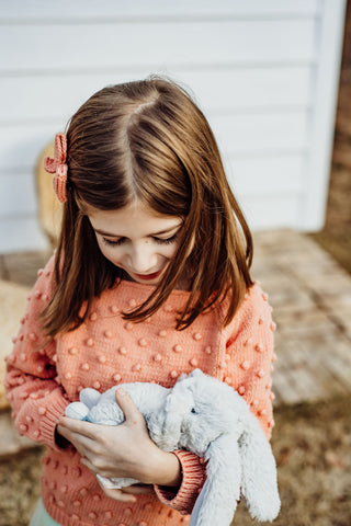 girl with stuffed bunny rabbit