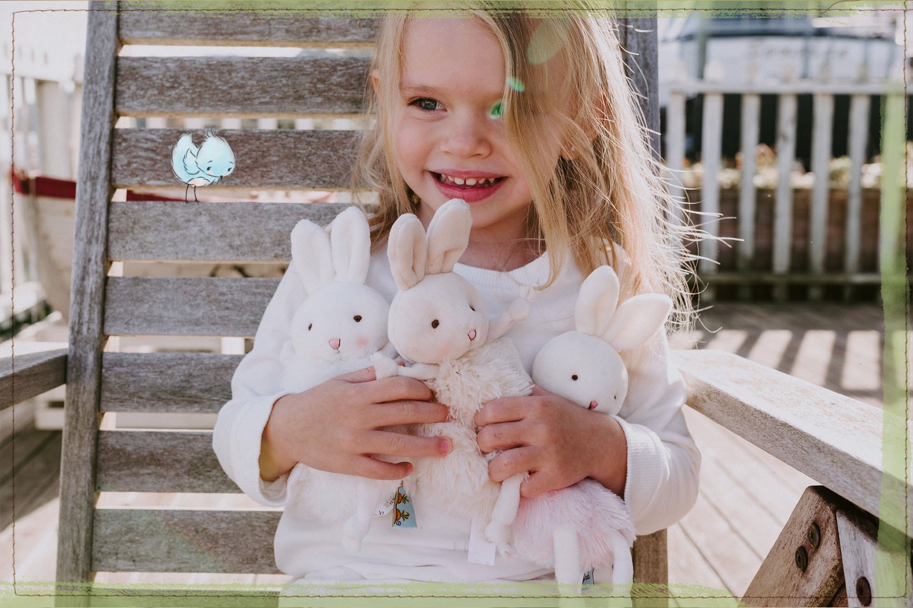 Girl holding a trio of cute white plush bunnies