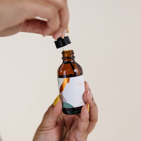 face oil in brown bottle with pipette