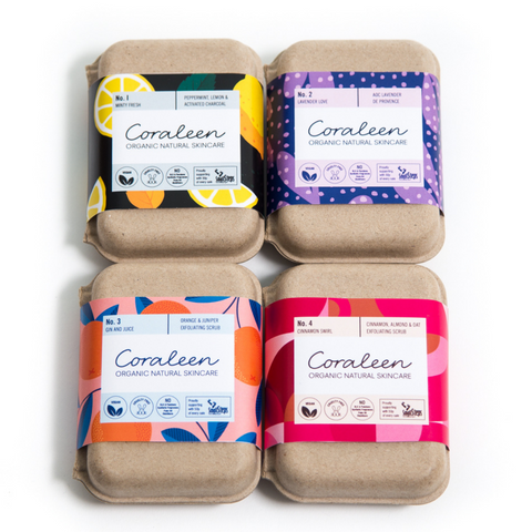 set of 4 boxed organic soaps with brightly coloured paper labels