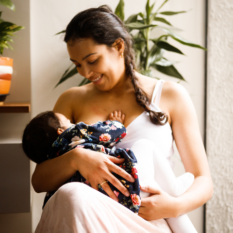 woman breastfeeding on chair