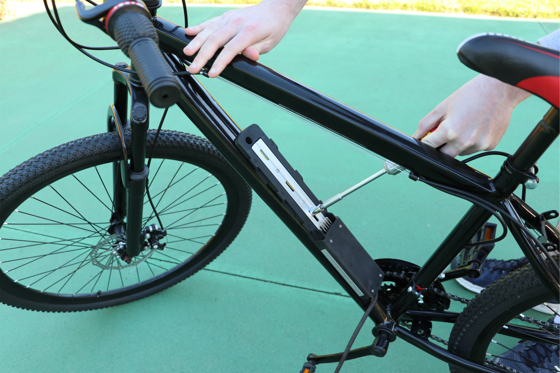 Fitting electric bicycle battery to frame