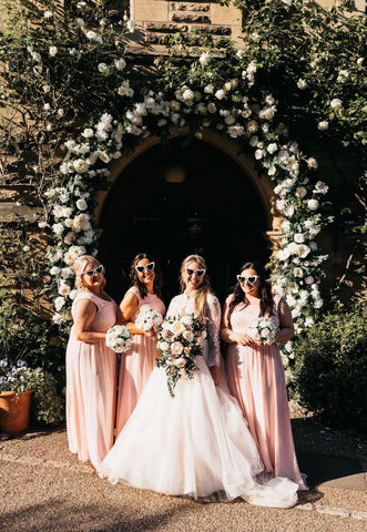 bride and bridesmaids in blush dresses