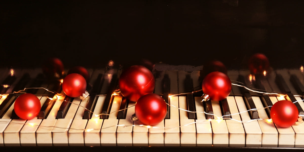 Piano keyboard with Christmas decorations, close-up