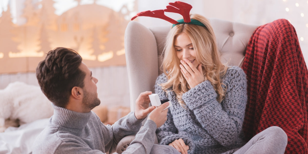 Surprised woman looking at engagement ring