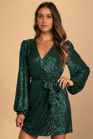 a shimmery emerald green wrap dress