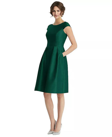 an emerald green satin cocktail dress with cap sleeves