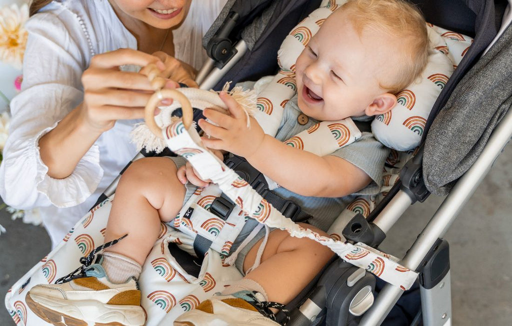 baby in pram with pram liner