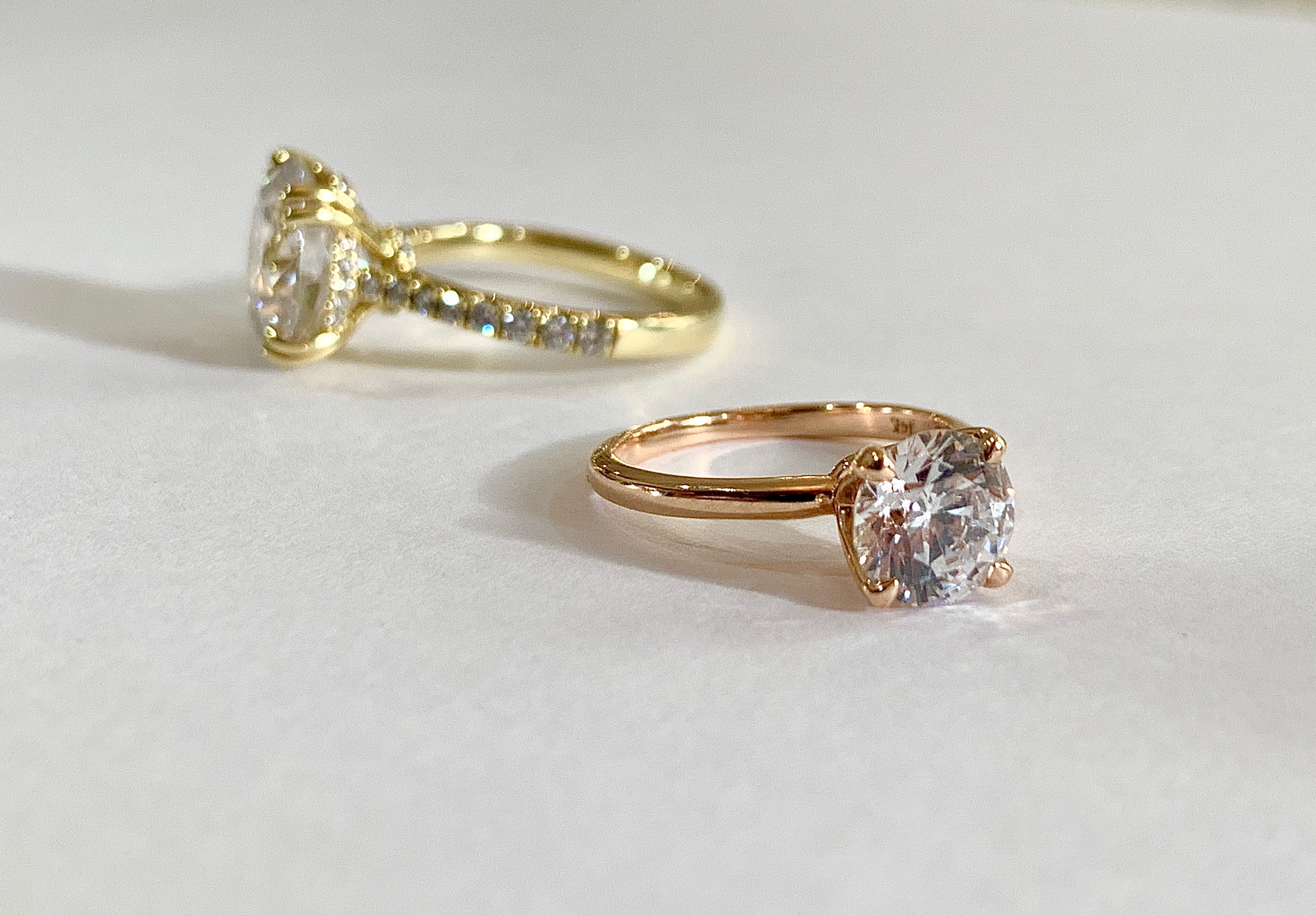 two engagement rings- diamond solitaires by dana walden nyc