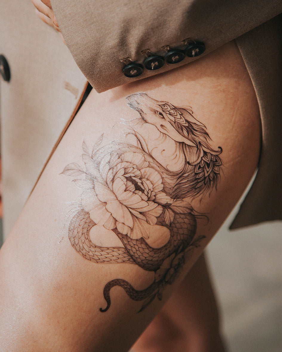 female dragon and flower hip tattooTikTok Search