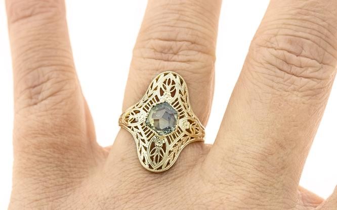 gold-cocktail-ring-with-gemstone