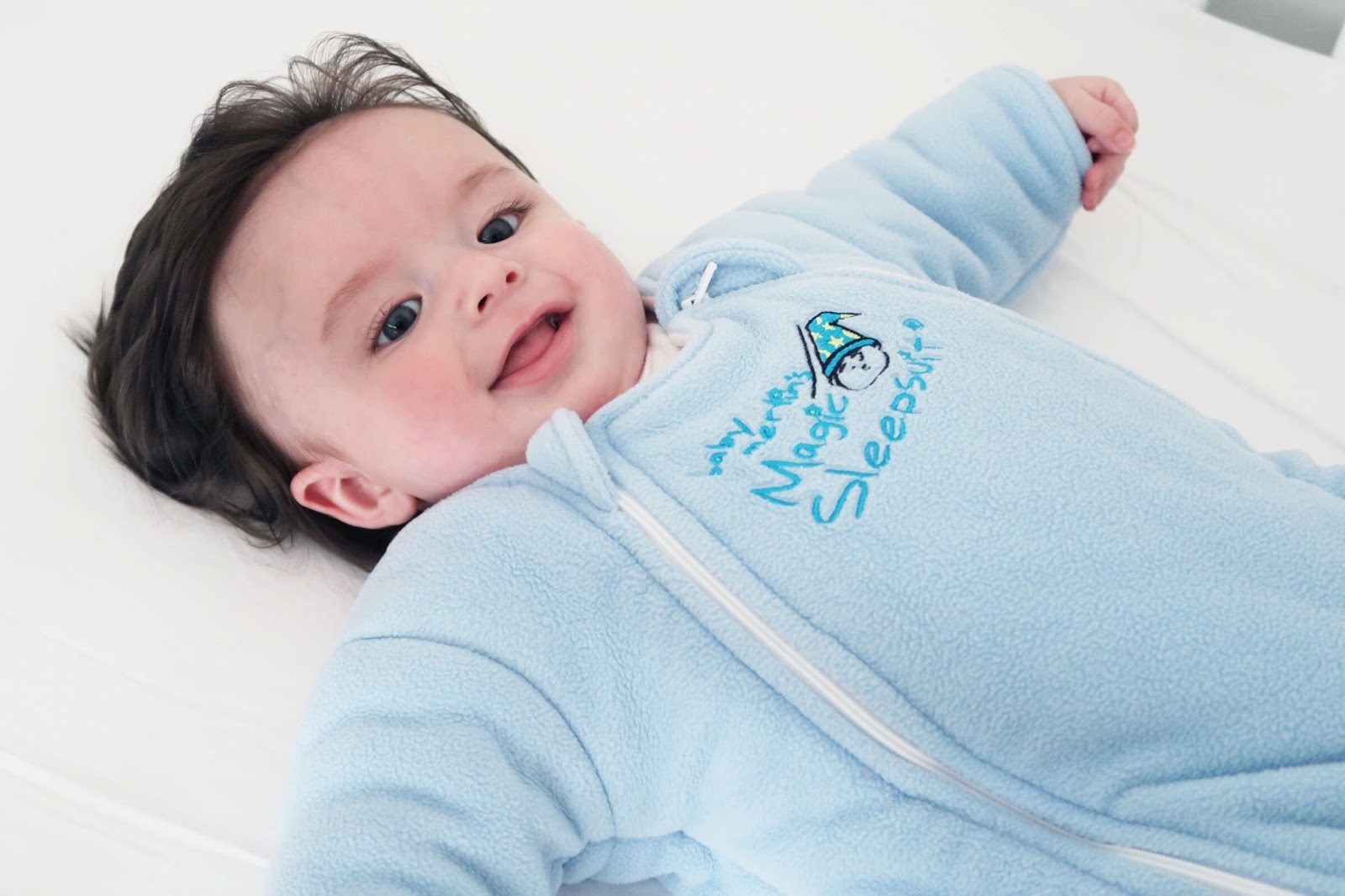 baby rolling over in merlin sleepsuit