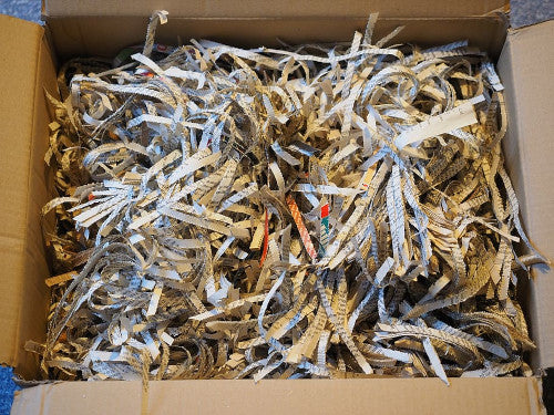 shredded papers using a strip-cut shredder