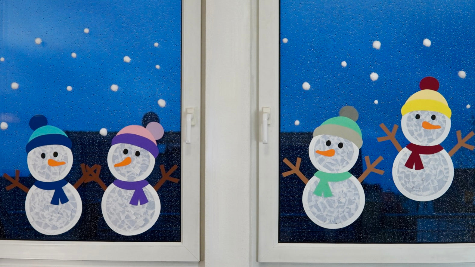 Make wintry window decorations with children