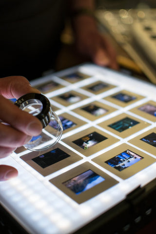 Mike Burns looking at expedition film slides