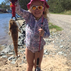 fishing with kids - girl catches a fish