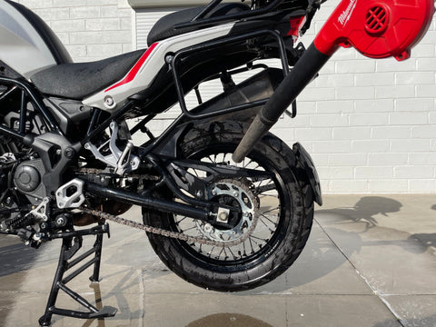 Using air blower to dry motorcycle