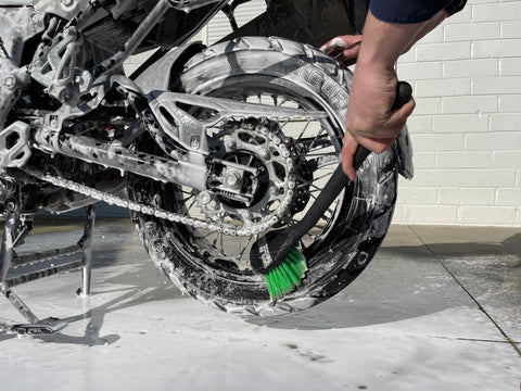 Cleaning Motorbike wheels with long handle wheel cleaning brush