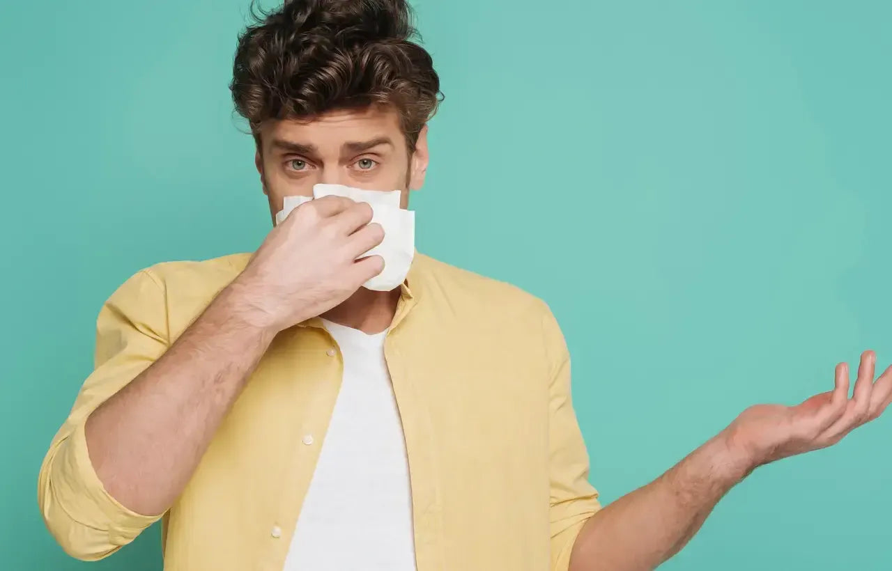 A man cleaning nose