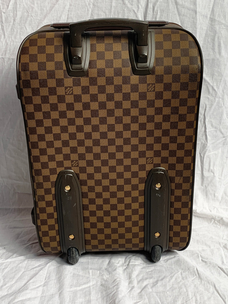 LOUIS VUITTON PEGASE 55 TROLLEY, monogram coated canvas with leather trims  and retractable top handle, front slip pocket and further zip pocket,  wheels, zip around closure and fabric lining interior with straps