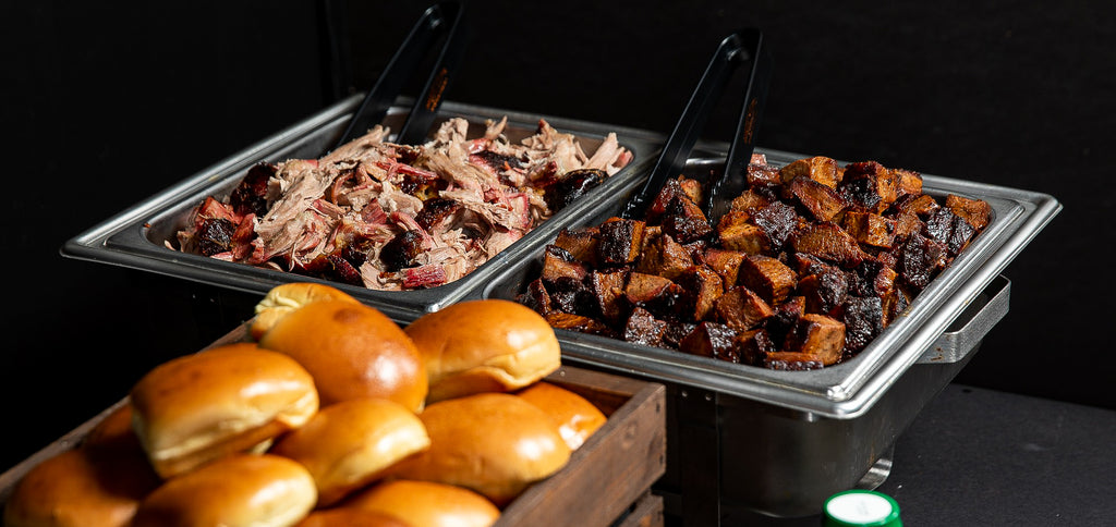 bbq meat and sides at a catering event by smokey d's bbq