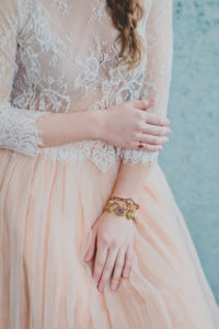 Vintage bracelet stack with lace and tulle bridesmaid dress.