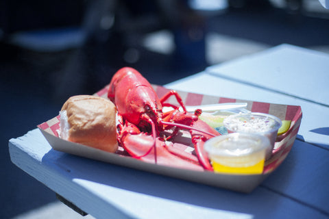 lobster and roll on paper plate