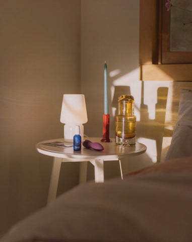 lifestlye image of Dip and other products sitting on a bedside table