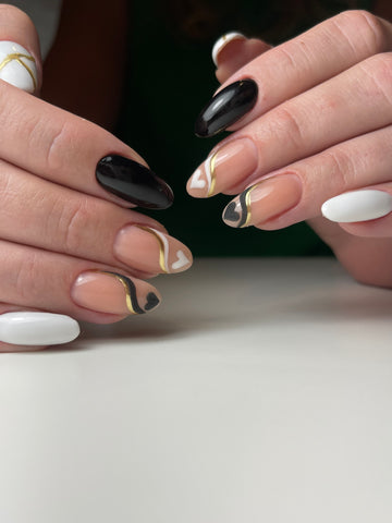 Beautiful Russian manicure, black and white gel polish, accented with gold metallic nail polish