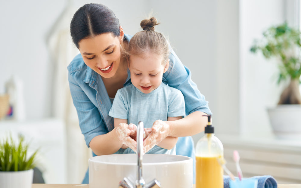 Mother and Daughter Washing Hands Together