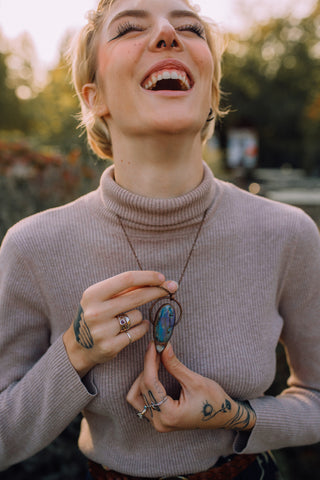 Beautiful Girl Showing Off Handmade Flashy Labradorite and Moonstone Pendant