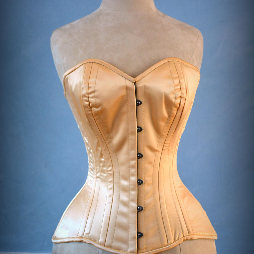 Classic satin corset wedding dress with wide frill. Bespoke steel