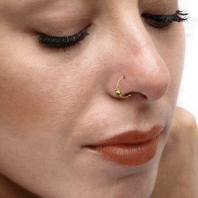 Close-up of model wearing nose ring