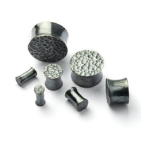 several sizes of hammered black silver double flared ear plugs all view