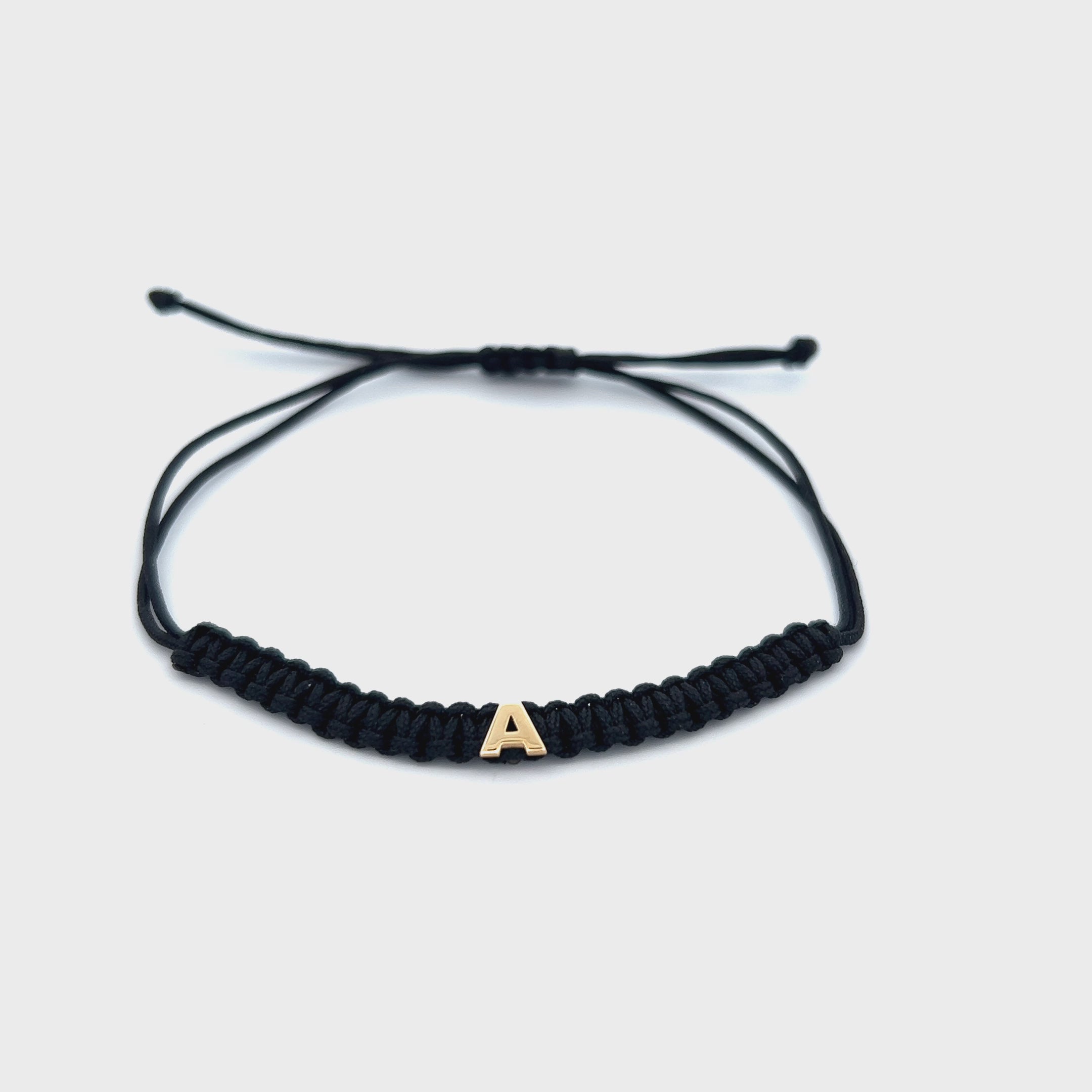 Bracelets - Black fabric bracelet with letter - ORO18KT - thumbnail - video - 1 | Rue des Mille