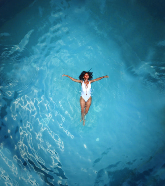 Girl Float in Pool Top View