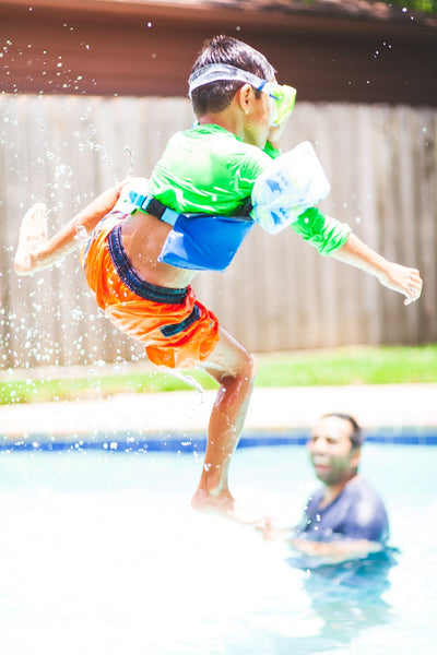 Kid jumping in pool
