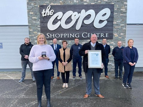 Emma McGarvey and Mark Sharkey of The Cope Dungloe with Members from many Cope Teams receive Business of The Year