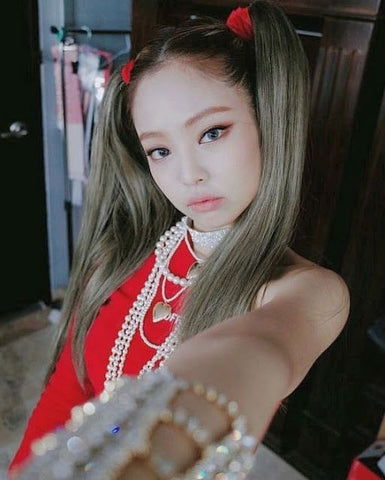 jennie kpop hairstyle with double high pony tail wearing red