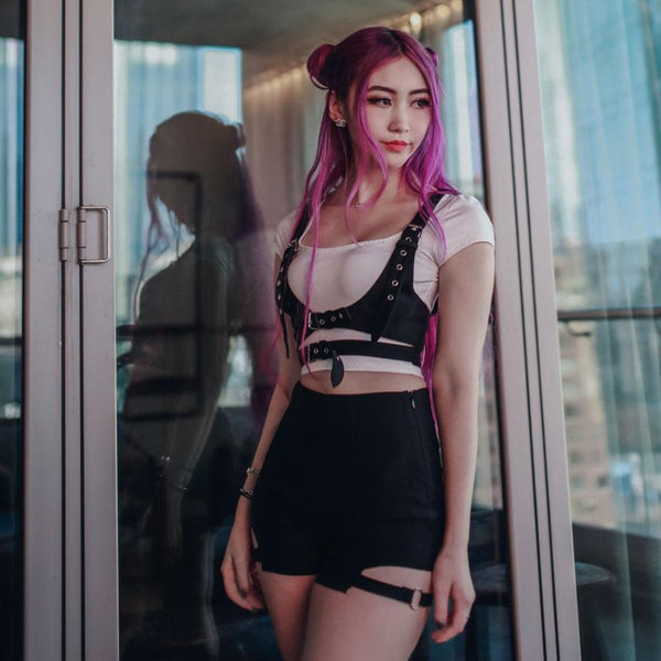 purple hair model wearing passionfruit strap harness