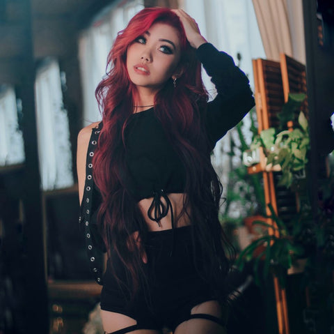 off shoulder sweatshirt and matching strappy shorts on red hair model